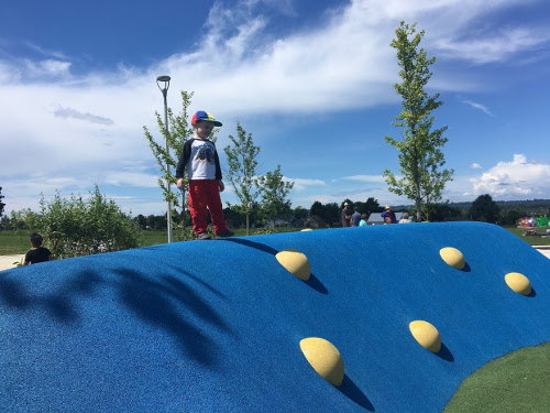 Julian stands on top of a rubber hill.