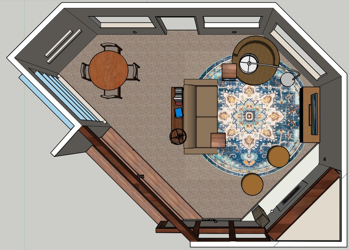 Living room layout. Furniture on right side anchored by a round rug. On the lift is the media cabinet and tv. Across from the TV is the couch. The round swivel chair is perpendicular to the couch. The couch and the swivel chair have a c-table.  In front of the fireplace, with is at a 45 degree angle from the TV, are two round ottomans. Behind the sofa is a narrow console table with a lamp and books. In the awkward corner to the left, next to the built-in bookcases, is a round table with four chairs.