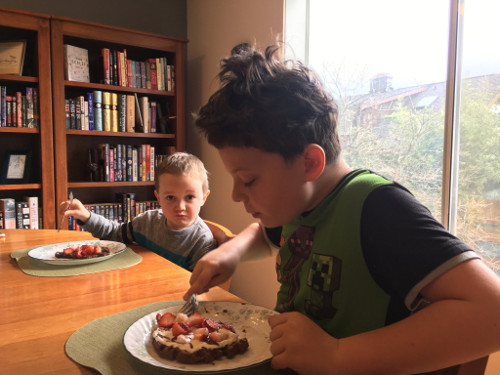 Calvin and Julian eating chocolate waffles.