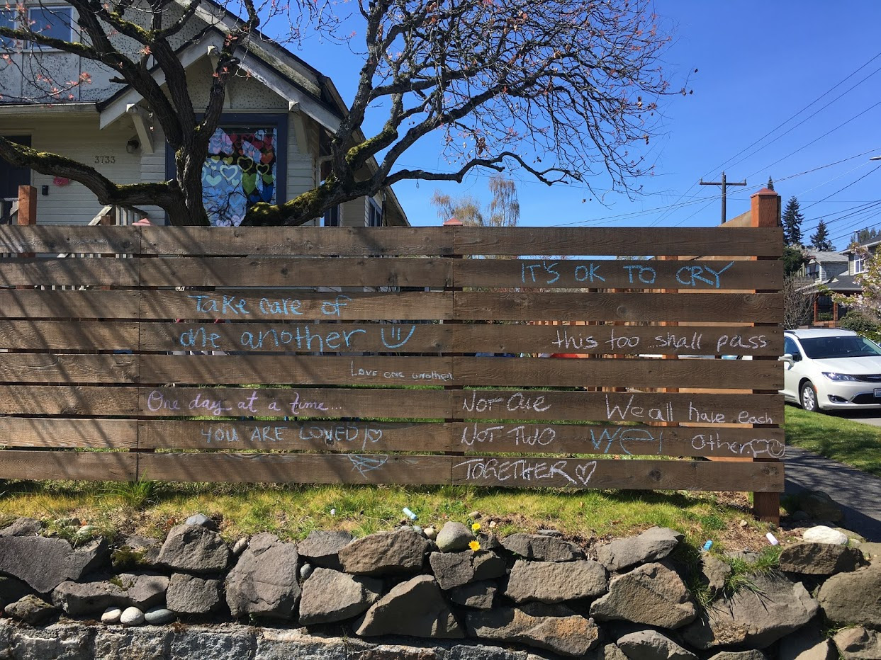 Fence with encouragements written in chalk.