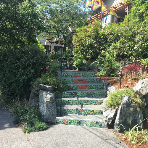 Steps with a mosaic picture of an orange poppy.