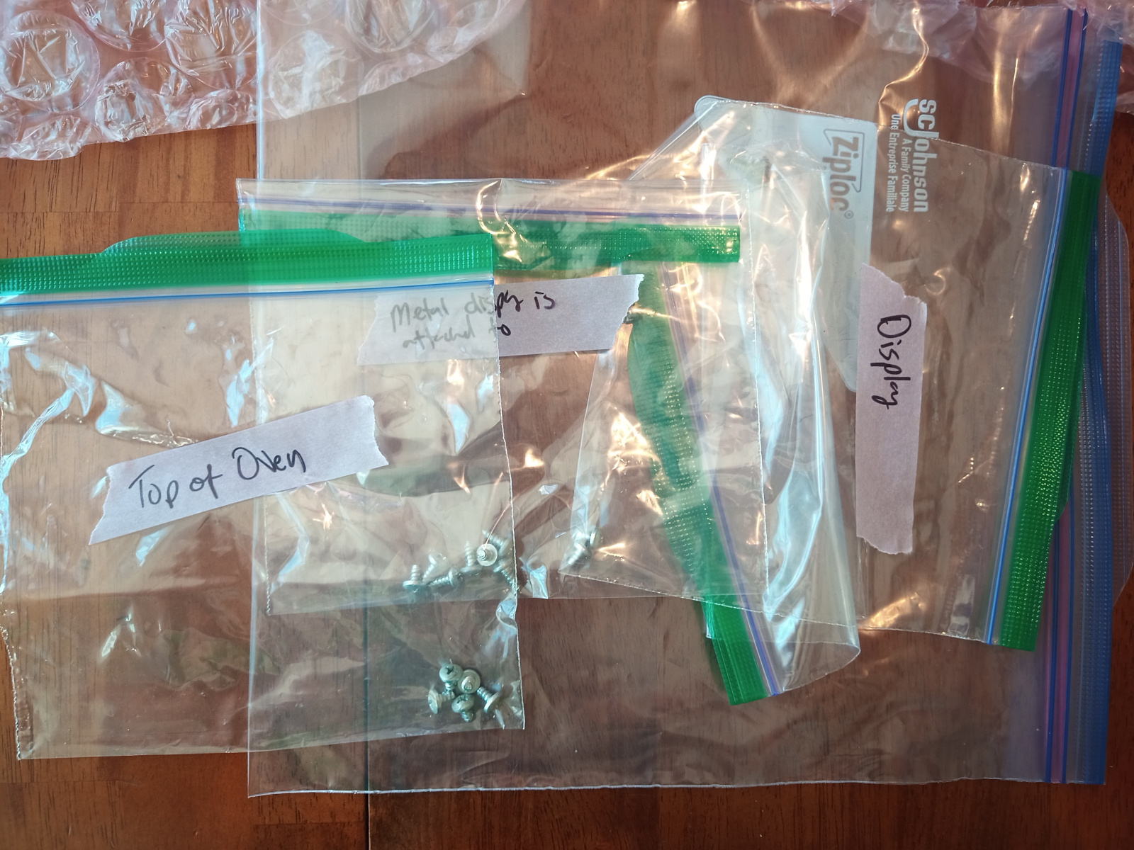 Labeled plastic bags with screws.